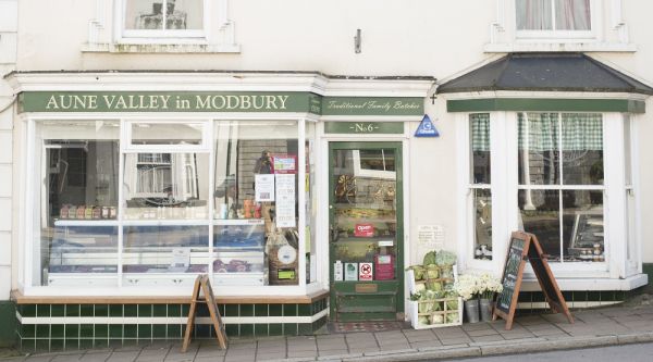The Aune Valley in Modbury shopfront on 6 Church Street, green-and-cream Traditional Family Butchers signage